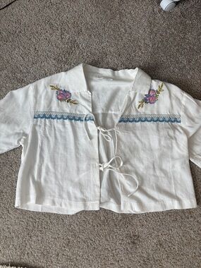 Medium floral short sleeve tie top